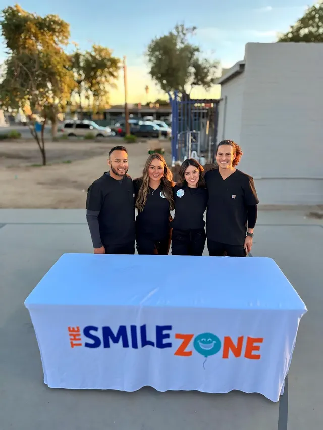 TheSmileZone team at their table at the Friendly House Winter Festival