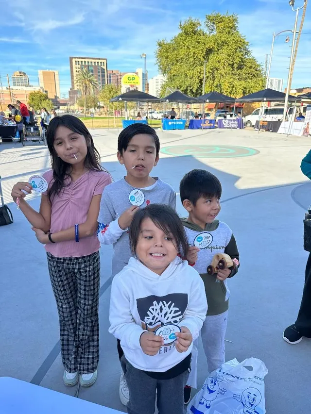 Children holding dental kits at the Winter Festival dental outreach