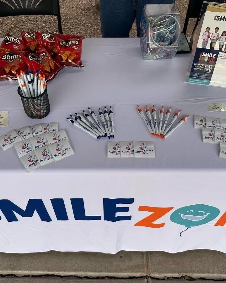 Dental supplies laid out on a TheSmileZone outreach table